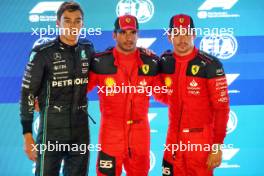 Qualifying top three in parc ferme (L to R): George Russell (GBR) Mercedes AMG F1, second; Carlos Sainz Jr (ESP) Ferrari, pole position; Charles Leclerc (MON) Ferrari, third. 16.09.2023. Formula 1 World Championship, Rd 16, Singapore Grand Prix, Marina Bay Street Circuit, Singapore, Qualifying Day.