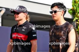 (L to R): Valtteri Bottas (FIN) Alfa Romeo F1 Team with Zhou Guanyu (CHN) Alfa Romeo F1 Team. 14.09.2023. Formula 1 World Championship, Rd 16, Singapore Grand Prix, Marina Bay Street Circuit, Singapore, Preparation Day.