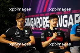 (L to R): George Russell (GBR) Mercedes AMG F1 and Zhou Guanyu (CHN) Alfa Romeo F1 Team in the FIA Press Conference.  14.09.2023. Formula 1 World Championship, Rd 16, Singapore Grand Prix, Marina Bay Street Circuit, Singapore, Preparation Day.