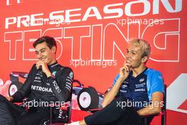 (L to R): George Russell (GBR) Mercedes AMG F1 and Alexander Albon (THA) Williams Racing, in the FIA Press Conference. 24.02.2023. Formula 1 Testing, Sakhir, Bahrain, Day Two.