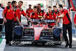 Ferrari SF-23 pushed down the pit lane by mechanics. 23.02.2023. Formula 1 Testing, Sakhir, Bahrain, Day One.