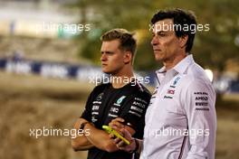 (L to R): Mick Schumacher (GER) Mercedes AMG F1 Reserve Driver with Toto Wolff (GER) Mercedes AMG F1 Shareholder and Executive Director. 23.02.2023. Formula 1 Testing, Sakhir, Bahrain, Day One.
