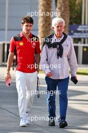 (L to R): Charles Leclerc (MON) Ferrari with Roger Benoit (SUI) Journalist. 23.02.2023. Formula 1 Testing, Sakhir, Bahrain, Day One.