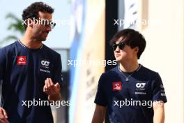 (L to R): Daniel Ricciardo (AUS) AlphaTauri with Yuki Tsunoda (JPN) AlphaTauri. 24.11.2023. Formula 1 World Championship, Rd 23, Abu Dhabi Grand Prix, Yas Marina Circuit, Abu Dhabi, Practice Day.