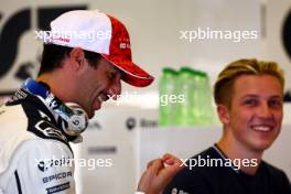 Daniel Ricciardo (AUS) AlphaTauri and Liam Lawson (NZL) AlphaTauri Reserve Driver. 26.11.2023. Formula 1 World Championship, Rd 23, Abu Dhabi Grand Prix, Yas Marina Circuit, Abu Dhabi, Race Day.