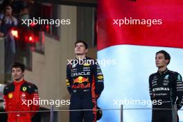 The podium (L to R): Charles Leclerc (MON) Ferrari, second; Max Verstappen (NLD) Red Bull Racing, race winner; George Russell (GBR) Mercedes AMG F1, third. 26.11.2023. Formula 1 World Championship, Rd 23, Abu Dhabi Grand Prix, Yas Marina Circuit, Abu Dhabi, Race Day.