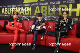 (L to R): Charles Leclerc (MON) Ferrari; Max Verstappen (NLD) Red Bull Racing and George Russell (GBR) Mercedes AMG F1 in the post race FIA Press Conference. 26.11.2023. Formula 1 World Championship, Rd 23, Abu Dhabi Grand Prix, Yas Marina Circuit, Abu Dhabi, Race Day.