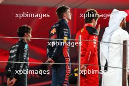 The podium: Charles Leclerc (MON) Ferrari, second; Max Verstappen (NLD) Red Bull Racing, race winner; George Russell (GBR) Mercedes AMG F1, third. 26.11.2023. Formula 1 World Championship, Rd 23, Abu Dhabi Grand Prix, Yas Marina Circuit, Abu Dhabi, Race Day.