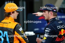 (L to R): Oscar Piastri (AUS) McLaren with Max Verstappen (NLD) Red Bull Racing in qualifying parc ferme. 25.11.2023. Formula 1 World Championship, Rd 23, Abu Dhabi Grand Prix, Yas Marina Circuit, Abu Dhabi, Qualifying Day.