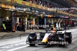 Sergio Perez (MEX) Red Bull Racing RB19 leaves the pits. 25.11.2023. Formula 1 World Championship, Rd 23, Abu Dhabi Grand Prix, Yas Marina Circuit, Abu Dhabi, Qualifying Day.