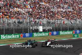 Lance Stroll (CDN) Aston Martin F1 Team AMR23 and Yuki Tsunoda (JPN) AlphaTauri AT04 battle for position. 22.10.2023. Formula 1 World Championship, Rd 19, United States Grand Prix, Austin, Texas, USA, Race Day.