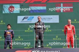 The podium (L to R): Ayumu Iwasa (JPN) Dams, second; Richard Verschoor (NED) Van Amersfoort Racing, race winner; Frederik Vesti (DEN) Prema Racing, third. 02.07.2023. FIA Formula 2 Championship, Rd 8, Feature Race, Spielberg, Austria, Sunday.