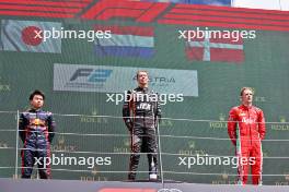 The podium (L to R): Ayumu Iwasa (JPN) Dams, second; Richard Verschoor (NED) Van Amersfoort Racing, race winner; Frederik Vesti (DEN) Prema Racing, third. 02.07.2023. FIA Formula 2 Championship, Rd 8, Feature Race, Spielberg, Austria, Sunday.
