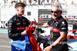 Theo Pourchaire (FRA) ART Grand Prix celebrates winning the F2 Championship in parc ferme with Beat Zehnder (SUI) Alfa Romeo F1 Sporting Director. 26.11.2023. Formula 2 Championship, Rd 14, Yas Marina Circuit, Abu Dhabi, UAE, Feature Race, Sunday.