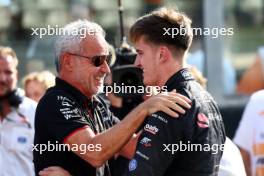 Theo Pourchaire (FRA) ART Grand Prix celebrates winning the F2 Championship in parc ferme with Beat Zehnder (SUI) Alfa Romeo F1 Sporting Director. 26.11.2023. Formula 2 Championship, Rd 14, Yas Marina Circuit, Abu Dhabi, UAE, Feature Race, Sunday.
