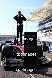 Theo Pourchaire (FRA) Alfa Romeo F1 Team Reserve Driver celebrates winning the F2 Championship in parc ferme. 26.11.2023. Formula 2 Championship, Rd 14, Yas Marina Circuit, Abu Dhabi, UAE, Feature Race, Sunday.
