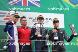 The podium (L to R): Gabriel Bortoleto (BRA) Trident, second; Zak O'Sullivan (GBR) Prema Racing, race winner; Caio Collet (BRA) Van Amersfoort Racing, third. 02.07.2023. FIA Formula 3 Championship, Rd 6, Feature Race, Spielberg, Austria, Sunday.