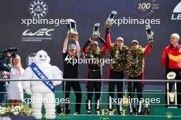 (L to R): Kamui Kobayashi (JPN) Toyota Gazoo Racing Team Principal; Ryo Hirakawa (JPN), Brendon Hartley (NZL), Sebastien Buemi (SUI) #08 Toyota Gazoo Racing, celebrate second position on the podium. 11.06.2023. FIA World Endurance Championship, Le Mans 24 Hours Race, Le Mans, France, Sunday.