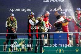 (L to R): Ryo Hirakawa (JPN), Sebastien Buemi (SUI), and Brendon Hartley (NZL) #08 Toyota Gazoo Racing, celebrate second position on the podium. 11.06.2023. FIA World Endurance Championship, Le Mans 24 Hours Race, Le Mans, France, Sunday.