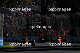 Sergio Perez (MEX) Red Bull Racing RB20 and Carlos Sainz Jr (ESP) Ferrari SF-24. 22.03.2024. Formula 1 World Championship, Rd 3, Australian Grand Prix, Albert Park, Melbourne, Australia, Practice Day.