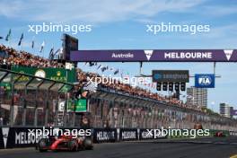 Race winner Carlos Sainz Jr (ESP) Ferrari SF-24 takes the chequered flag at the end of the race. 24.03.2024. Formula 1 World Championship, Rd 3, Australian Grand Prix, Albert Park, Melbourne, Australia, Race Day.