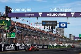 Race winner Carlos Sainz Jr (ESP) Ferrari SF-24 takes the chequered flag at the end of the race. 24.03.2024. Formula 1 World Championship, Rd 3, Australian Grand Prix, Albert Park, Melbourne, Australia, Race Day.