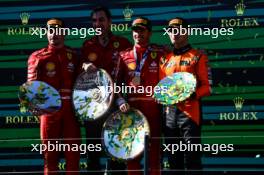 The podium (L to R): Charles Leclerc (MON) Ferrari, second; Matteo Togninalli (ITA) Ferrari Head of Track Engineering; Carlos Sainz Jr (ESP) Ferrari, race winner; Lando Norris (GBR) McLaren, third. 24.03.2024. Formula 1 World Championship, Rd 3, Australian Grand Prix, Albert Park, Melbourne, Australia, Race Day.
