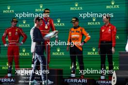 The podium (L to R): Charles Leclerc (MON) Ferrari, second; Carlos Sainz Jr (ESP) Ferrari, race winner; Lando Norris (GBR) McLaren, third; Matteo Togninalli (ITA) Ferrari Head of Track Engineering. 24.03.2024. Formula 1 World Championship, Rd 3, Australian Grand Prix, Albert Park, Melbourne, Australia, Race Day.