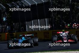 George Russell (GBR) Mercedes AMG F1 W15 and Nico Hulkenberg (GER) Haas VF-24. 24.03.2024. Formula 1 World Championship, Rd 3, Australian Grand Prix, Albert Park, Melbourne, Australia, Race Day.