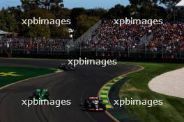 Valtteri Bottas (FIN) Sauber C44 and Nico Hulkenberg (GER) Haas VF-24. 24.03.2024. Formula 1 World Championship, Rd 3, Australian Grand Prix, Albert Park, Melbourne, Australia, Race Day.