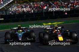 Sergio Perez (MEX) Red Bull Racing RB20 and Lewis Hamilton (GBR) Mercedes AMG F1 W15. 24.03.2024. Formula 1 World Championship, Rd 3, Australian Grand Prix, Albert Park, Melbourne, Australia, Race Day.