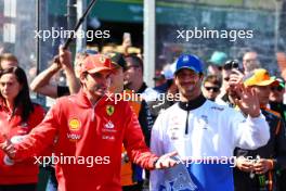 (L to R): Carlos Sainz Jr (ESP) Ferrari and Daniel Ricciardo (AUS) RB on the drivers' parade. 24.03.2024. Formula 1 World Championship, Rd 3, Australian Grand Prix, Albert Park, Melbourne, Australia, Race Day.