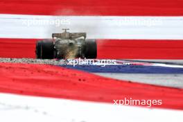 Lewis Hamilton (GBR) Mercedes AMG F1 W15 sends sparks flying. 28.06.2024. Formula 1 World Championship, Rd 11, Austrian Grand Prix, Spielberg, Austria, Sprint Qualifying Day.