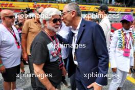 (L to R): George Lucas (USA) Star Wars Creator on the grid with Stefano Domenicali (ITA) Formula One President and CEO. 30.06.2024. Formula 1 World Championship, Rd 11, Austrian Grand Prix, Spielberg, Austria, Race Day.