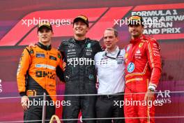 The podium (L to R): Oscar Piastri (AUS) McLaren, second; George Russell (GBR) Mercedes AMG F1, race winner; Marcus Dudley (GBR) Mercedes AMG F1 Race Engineer; Carlos Sainz Jr (ESP) Ferrari, third. 30.06.2024. Formula 1 World Championship, Rd 11, Austrian Grand Prix, Spielberg, Austria, Race Day.