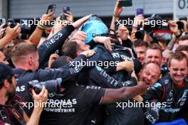 Race winner George Russell (GBR) Mercedes AMG F1 celebrates in parc ferme with the team. 30.06.2024. Formula 1 World Championship, Rd 11, Austrian Grand Prix, Spielberg, Austria, Race Day.
