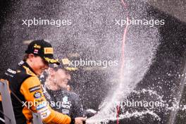 Oscar Piastri (AUS) McLaren celebrates his second position in parc ferme with race winner George Russell (GBR) Mercedes AMG F1. 30.06.2024. Formula 1 World Championship, Rd 11, Austrian Grand Prix, Spielberg, Austria, Race Day.