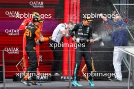 (L to R): Second placed Oscar Piastri (AUS) McLaren and race winner George Russell (GBR) Mercedes AMG F1 celebrate on the podium. 30.06.2024. Formula 1 World Championship, Rd 11, Austrian Grand Prix, Spielberg, Austria, Race Day.