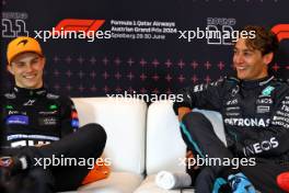 (L to R): Oscar Piastri (AUS) McLaren and George Russell (GBR) Mercedes AMG F1 in the post race FIA Press Conference. 30.06.2024. Formula 1 World Championship, Rd 11, Austrian Grand Prix, Spielberg, Austria, Race Day.