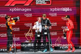 The podium (L to R): Oscar Piastri (AUS) McLaren, second; Marcus Dudley (GBR) Mercedes AMG F1 Race Engineer; George Russell (GBR) Mercedes AMG F1, race winner; Carlos Sainz Jr (ESP) Ferrari, third. 30.06.2024. Formula 1 World Championship, Rd 11, Austrian Grand Prix, Spielberg, Austria, Race Day.