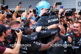 Race winner George Russell (GBR) Mercedes AMG F1 celebrates in parc ferme with the team. 30.06.2024. Formula 1 World Championship, Rd 11, Austrian Grand Prix, Spielberg, Austria, Race Day.