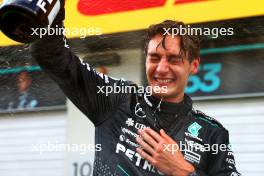 Race winner George Russell (GBR) Mercedes AMG F1 celebrates with the team after the race. 30.06.2024. Formula 1 World Championship, Rd 11, Austrian Grand Prix, Spielberg, Austria, Race Day.