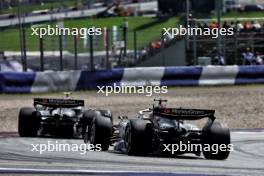 Kevin Magnussen (DEN) Haas VF-24 leads Nico Hulkenberg (GER) Haas VF-24. 30.06.2024. Formula 1 World Championship, Rd 11, Austrian Grand Prix, Spielberg, Austria, Race Day.