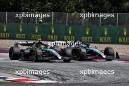 Lewis Hamilton (GBR) Mercedes AMG F1 W15 and George Russell (GBR) Mercedes AMG F1 W15 battle for position. 30.06.2024. Formula 1 World Championship, Rd 11, Austrian Grand Prix, Spielberg, Austria, Race Day.