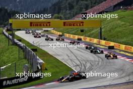 Max Verstappen (NLD) Red Bull Racing RB20 leads at the start of the race. 30.06.2024. Formula 1 World Championship, Rd 11, Austrian Grand Prix, Spielberg, Austria, Race Day.