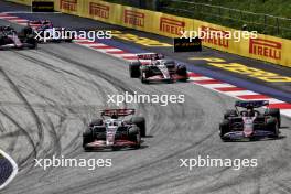 Nico Hulkenberg (GER) Haas VF-24 and Esteban Ocon (FRA) Alpine F1 Team A524 battle for position. 30.06.2024. Formula 1 World Championship, Rd 11, Austrian Grand Prix, Spielberg, Austria, Race Day.