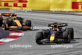 Max Verstappen (NLD) Red Bull Racing RB20 leads Lando Norris (GBR) McLaren MCL38. 30.06.2024. Formula 1 World Championship, Rd 11, Austrian Grand Prix, Spielberg, Austria, Race Day.