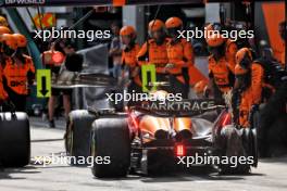 Lando Norris (GBR) McLaren MCL38 makes a pit stop with a puncture after contact with Max Verstappen (NLD) Red Bull Racing RB20. 30.06.2024. Formula 1 World Championship, Rd 11, Austrian Grand Prix, Spielberg, Austria, Race Day.