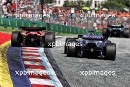 Charles Leclerc (MON) Ferrari SF-24 and Alexander Albon (THA) Williams Racing FW46. 30.06.2024. Formula 1 World Championship, Rd 11, Austrian Grand Prix, Spielberg, Austria, Race Day.