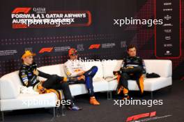 (L to R): Oscar Piastri (AUS) McLaren; Max Verstappen (NLD) Red Bull Racing; and Lando Norris (GBR) McLaren, in the post Sprint FIA Press Conference. 29.06.2024. Formula 1 World Championship, Rd 11, Austrian Grand Prix, Spielberg, Austria, Sprint and Qualifying Day.
